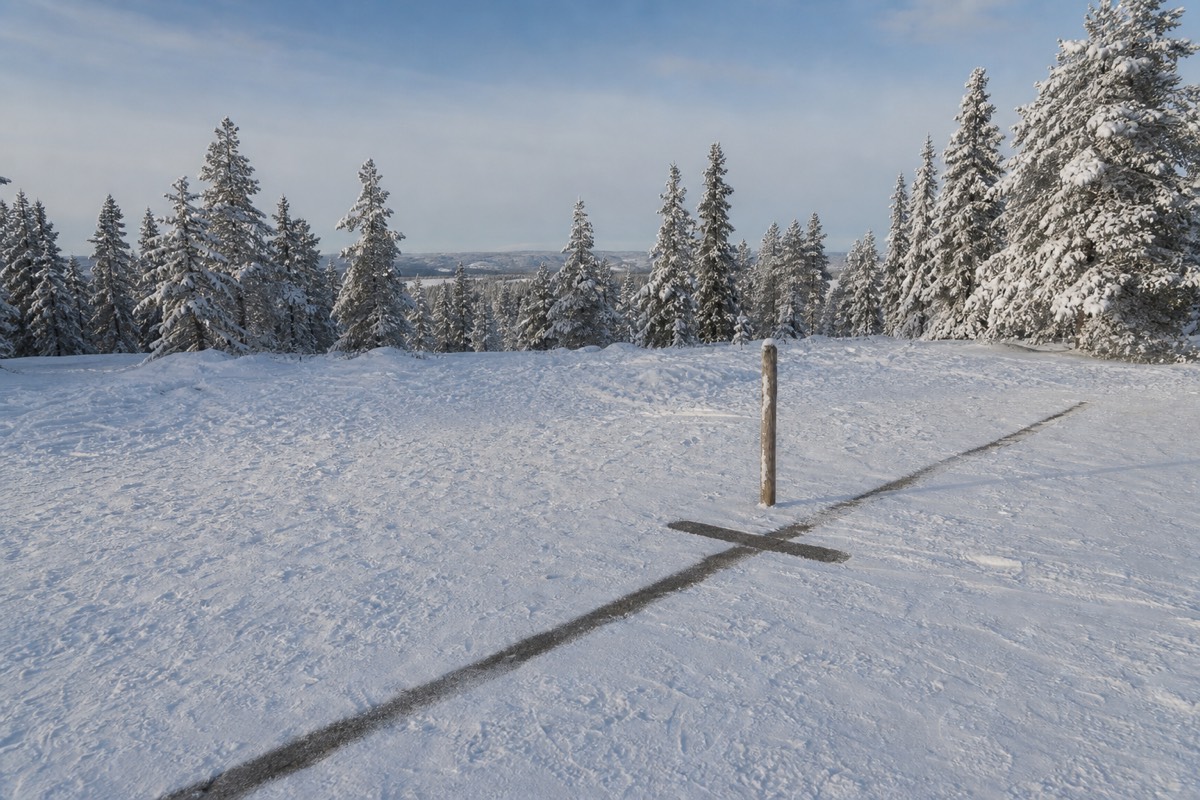 The painted Arctic Circle line marker at Santa Claus Village near Rovaniemi, Finland