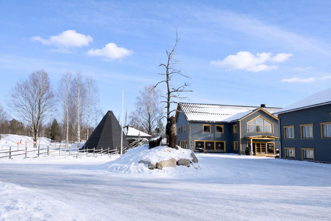 Apukka Resort Arctic hotel in Lapland with traditional architecture and winter scenery, seen during a tour with Rovaniemi Tours